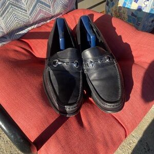 Cole Haan Black Leather Slip-Ons with Silver Detailing